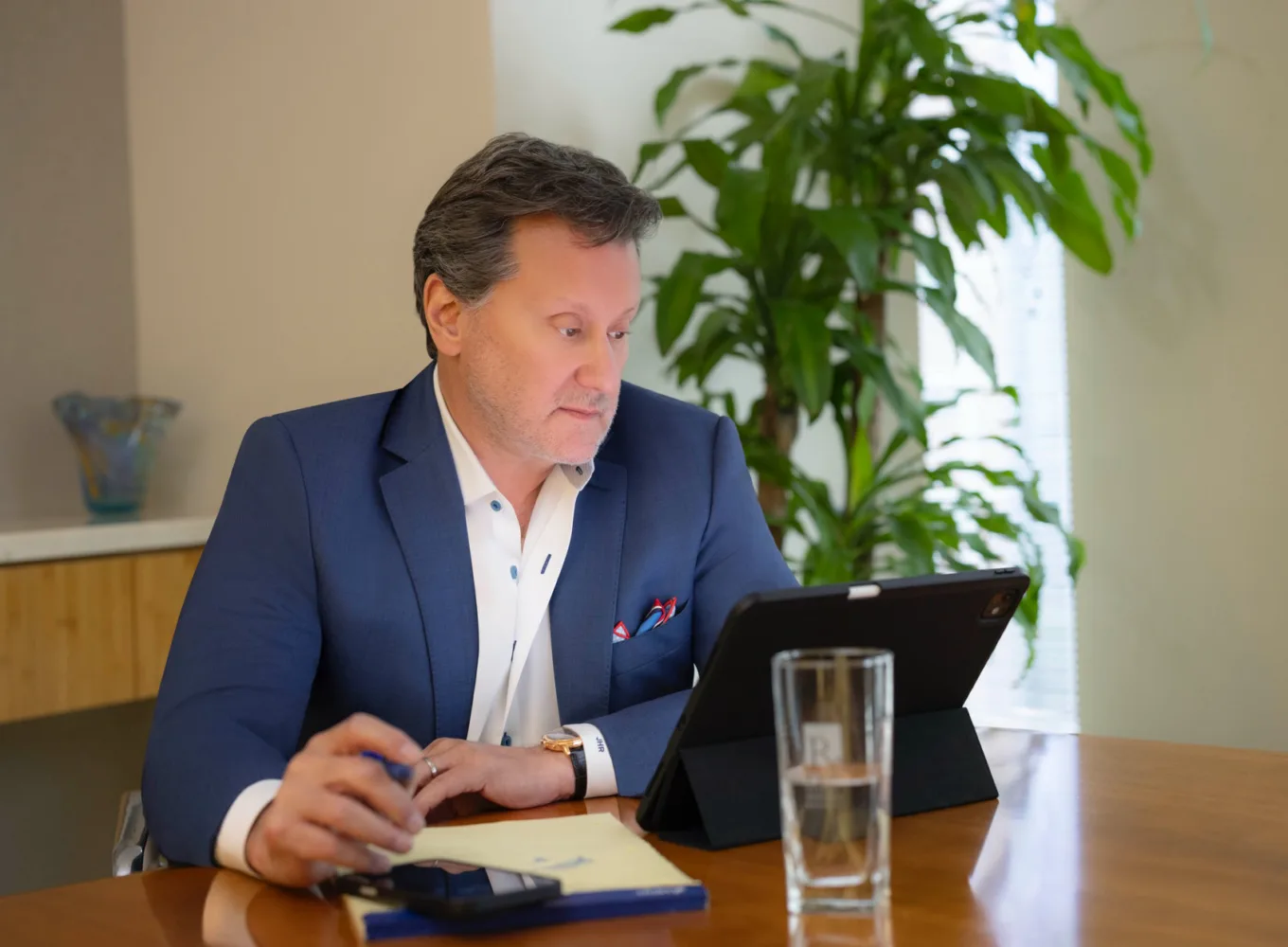 Jeff Rasansky reviewing information on a tablet