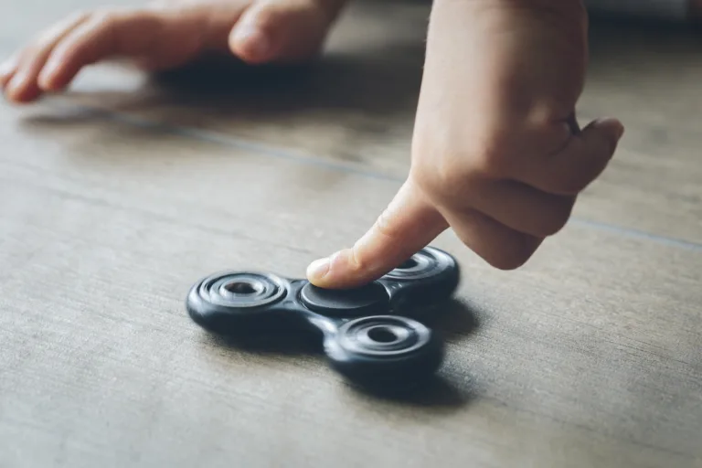 Boy Playing With Fidget Spinner